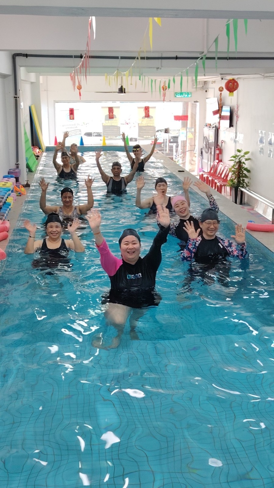 Adults enjoying an aqua exercise class
